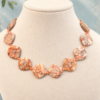 Peach Sunset on stand Peach Sunset Necklace